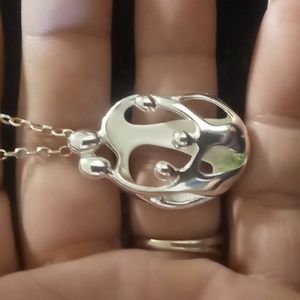 Vintage Carolyn Pollack living family gathering 925 silver on a 925 wheat chain.